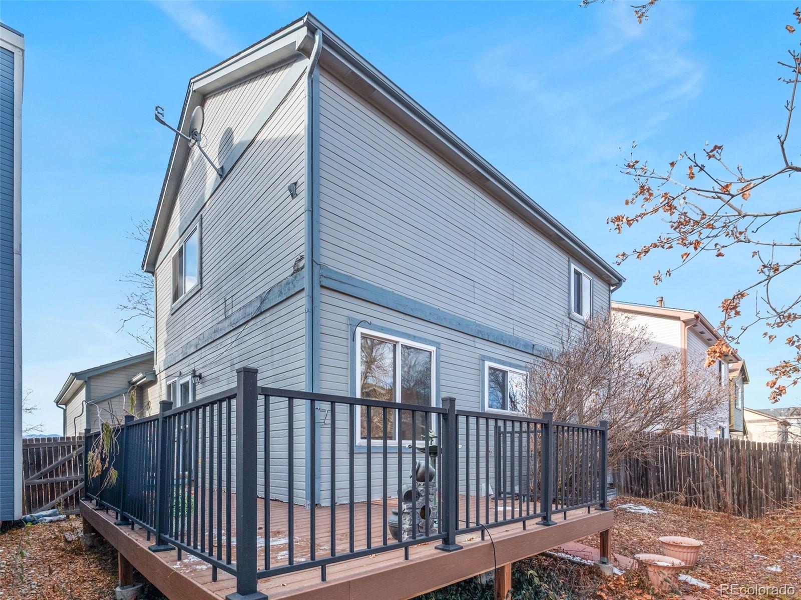 10016 Raritan Way Thornton, CO 80260 - Photo 38 of 43 a view of a house with wooden fence