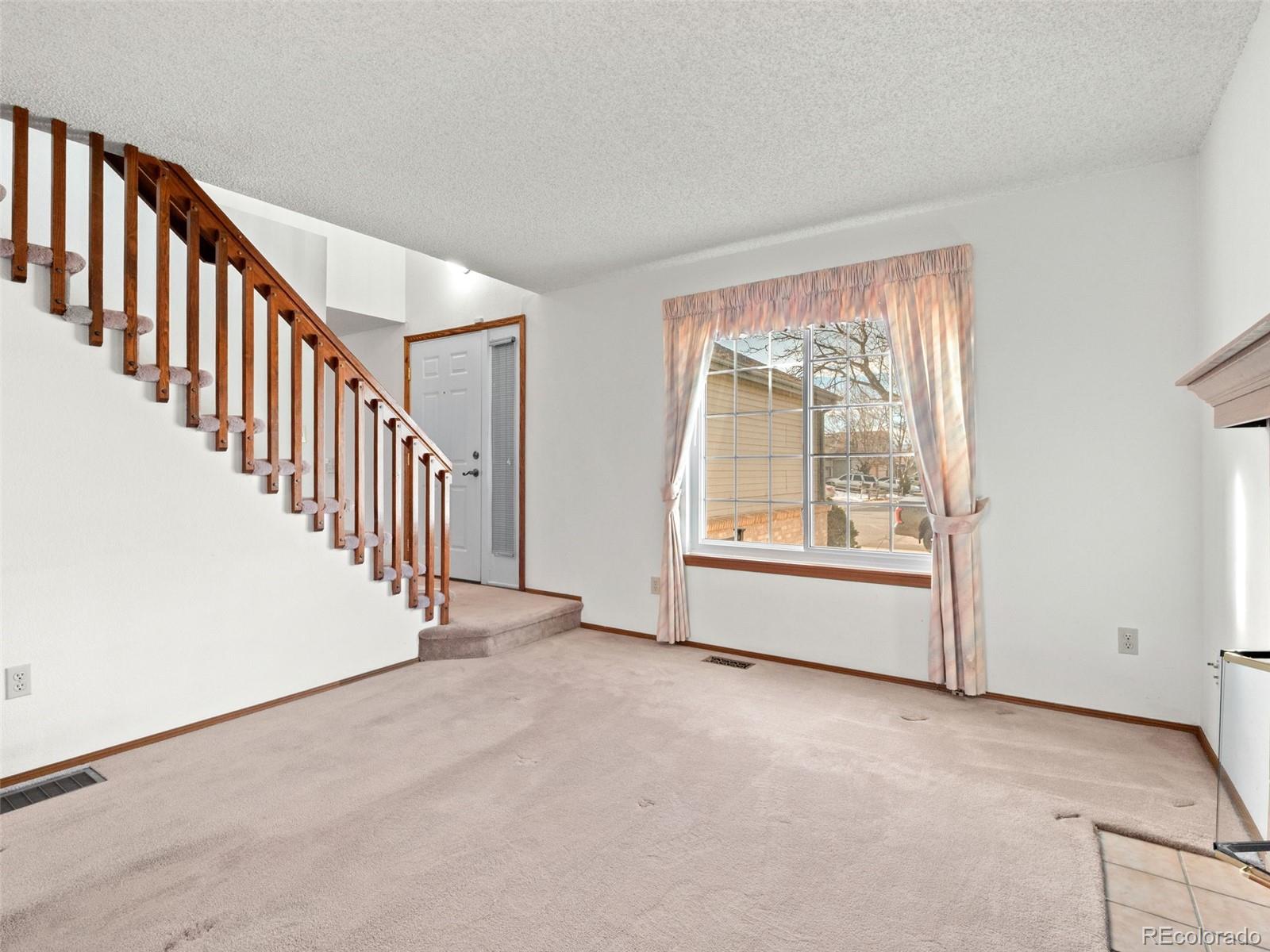 10016 Raritan Way Thornton, CO 80260 - Photo 6 of 43 an empty room with windows
