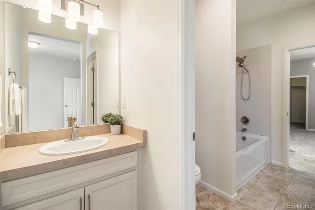 a bathroom with a toilet a sink and a bathtub