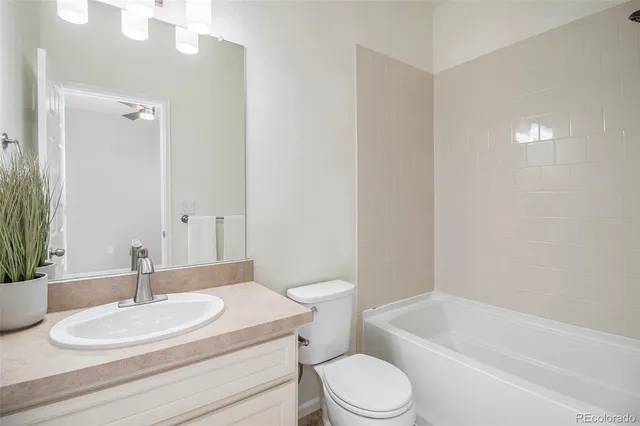 an aerial view of residential houses with outdoor space and ocean view