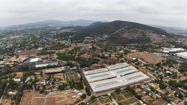 an aerial view of residential house with parking space
