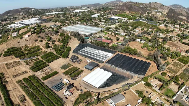 an aerial view of a residential apartment building with a mountain