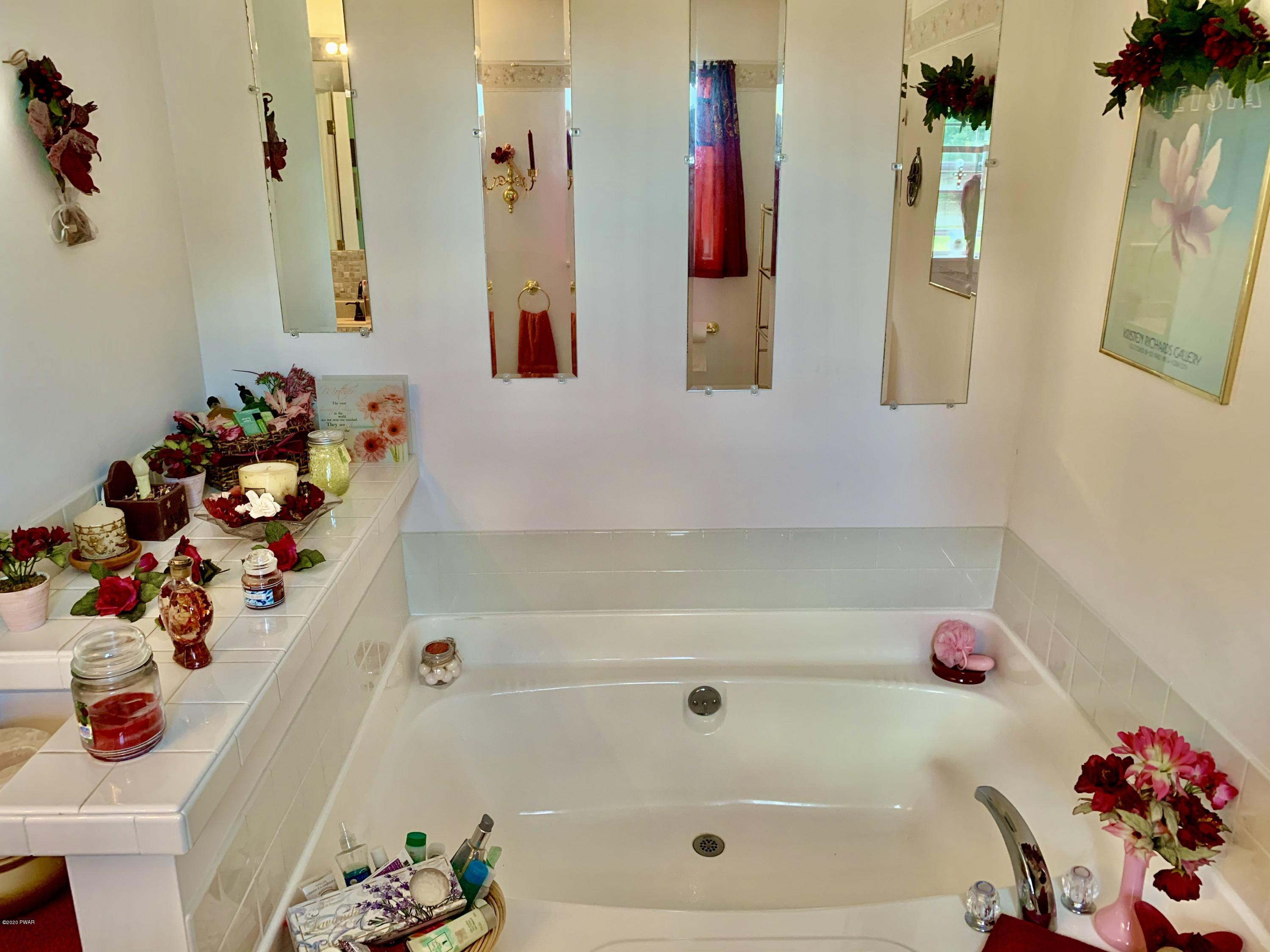 678 Stock Farm Road Lake Ariel, PA 18436 - Photo 29 of 41 a bathroom with a bathtub and a shower