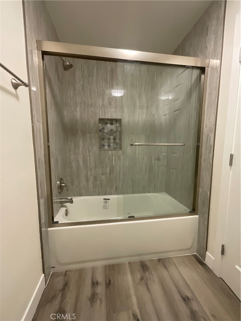 16862 Green, Unit 2 Huntington Beach, CA 92649 - Photo 13 of 13 a bathroom with a bathtub and a shower
