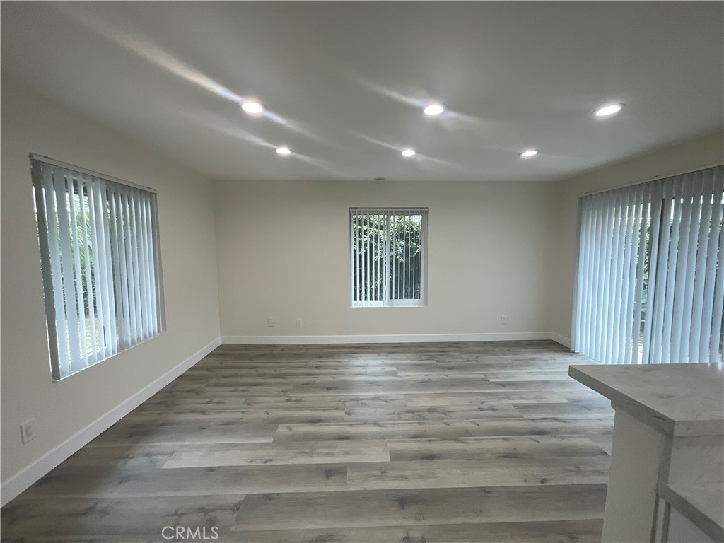16862 Green, Unit 2 Huntington Beach, CA 92649 - Photo 3 of 13 a view of an empty room and window