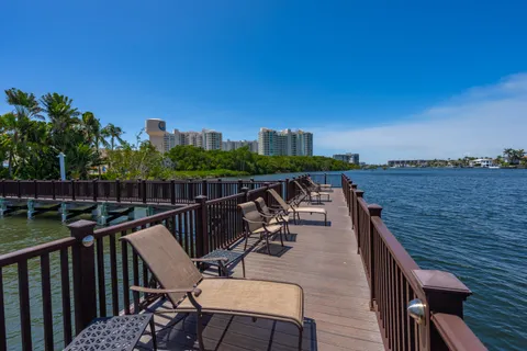 a view of a balcony with wooden floor and city view