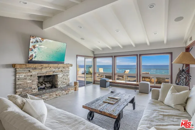 a living room with furniture and a table