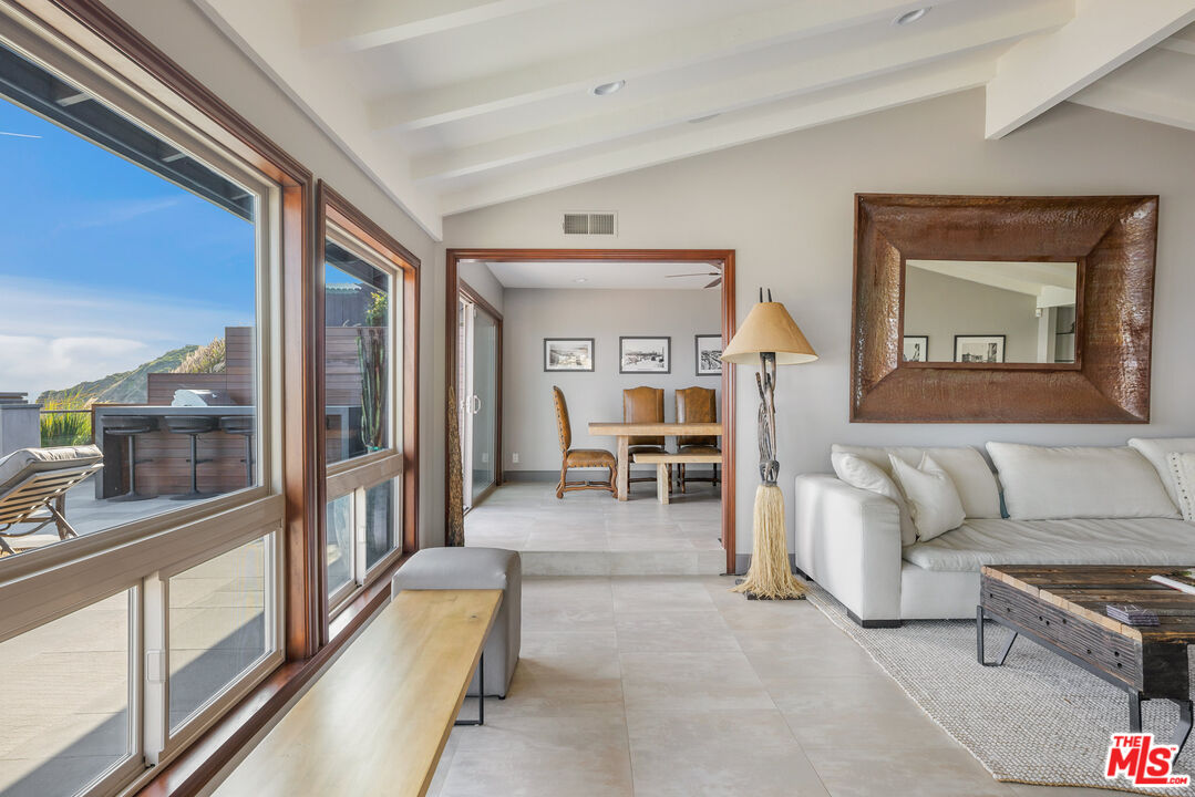 18074 Coastline Drive Malibu, CA 90265 - Photo 14 of 33 a living room with furniture and a table