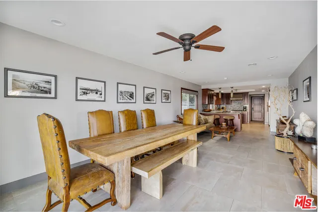 a large kitchen with stainless steel appliances granite countertop a lot of counter space and a sink
