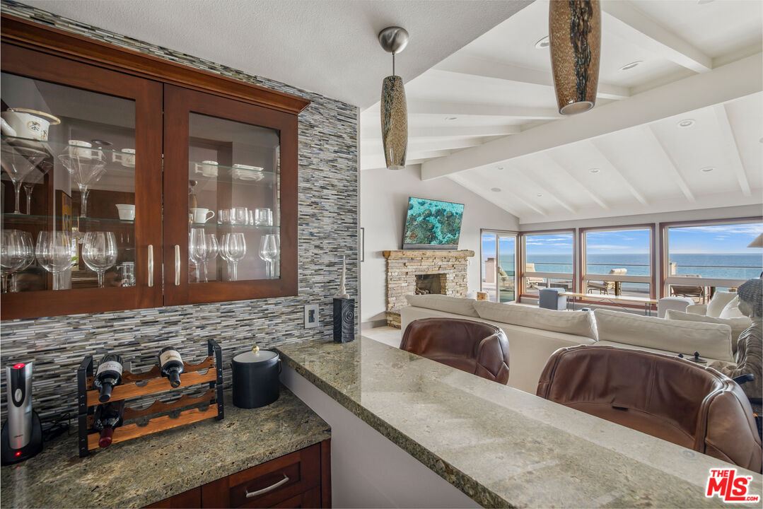 18074 Coastline Drive Malibu, CA 90265 - Photo 17 of 33 a living room with stainless steel appliances granite countertop furniture and a kitchen view