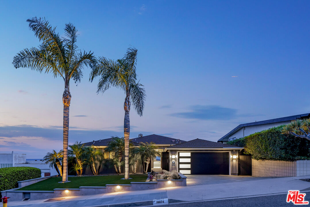 18074 Coastline Drive Malibu, CA 90265 - Photo 2 of 33 a front view of a house with palm trees