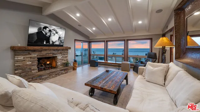 a terrace with outdoor seating and city view