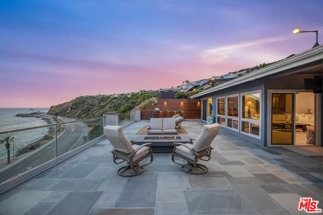 a view of a terrace with furniture