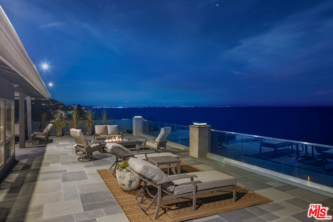 18074 Coastline Drive Malibu, CA 90265 - Photo 30 of 33 a view of a tables and chairs on the roof
