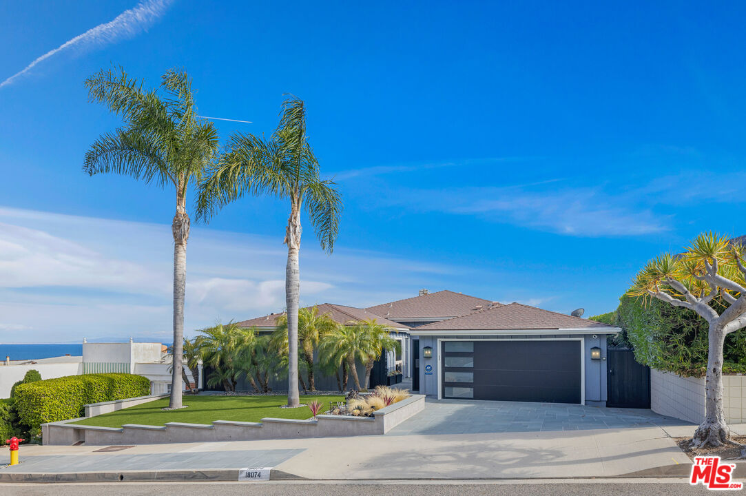 18074 Coastline Drive Malibu, CA 90265 - Photo 7 of 33 a view of a house with a swimming pool