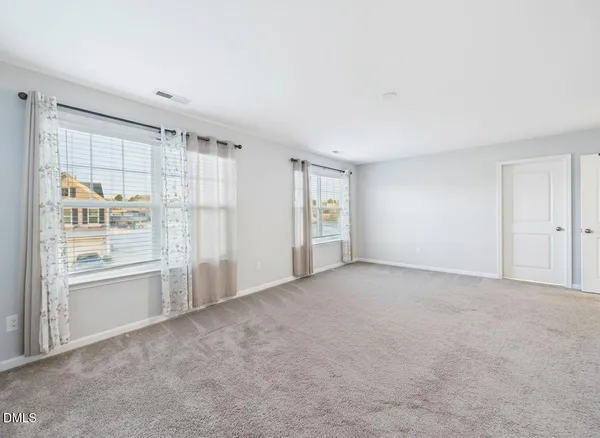 a room with furniture and white walls