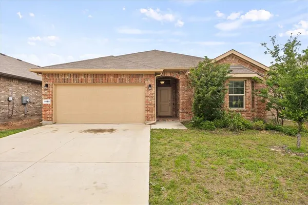 a view of a house with a yard and garage