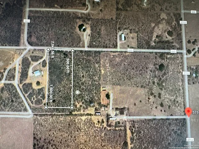 view of a bathroom with a window and chandelier