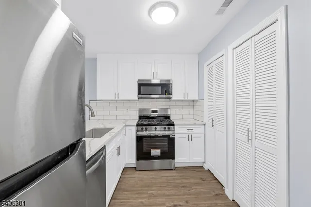 a kitchen with a stove and a microwave