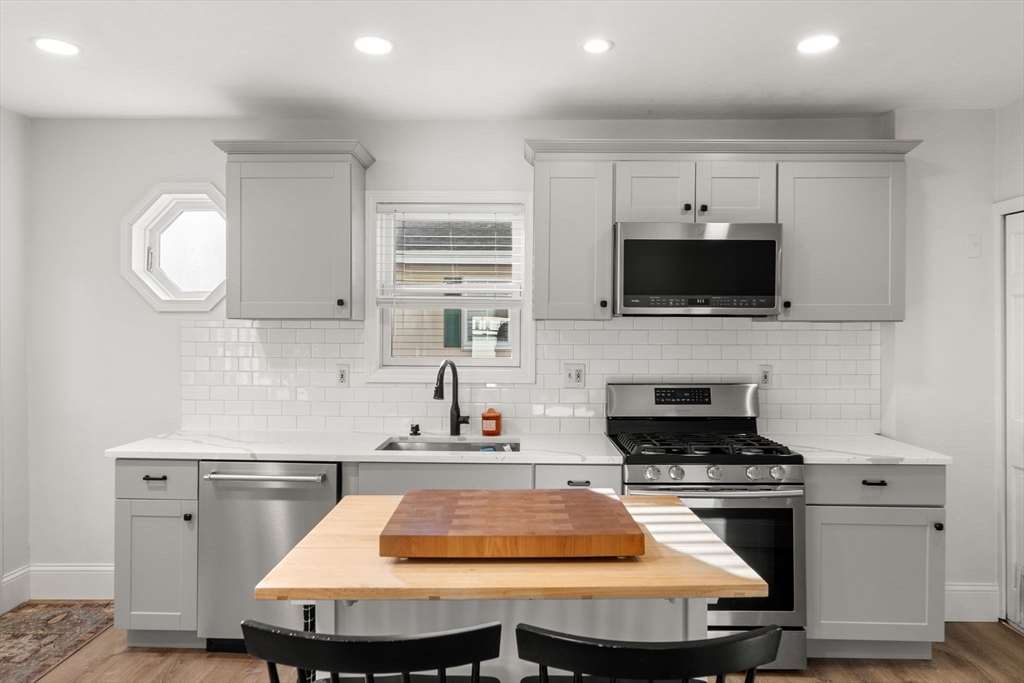 11 Pickman Road Salem, MA 01970 - Photo 5 of 40 a kitchen with kitchen island a sink appliances and cabinets