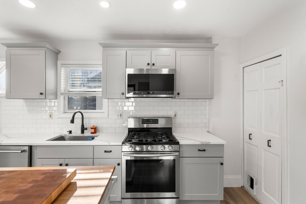 11 Pickman Road Salem, MA 01970 - Photo 6 of 40 a kitchen with a stove and a sink