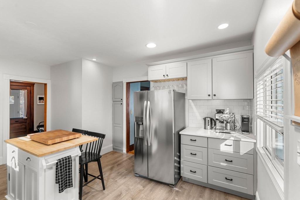 11 Pickman Road Salem, MA 01970 - Photo 8 of 40 a kitchen with cabinets appliances and a center island
