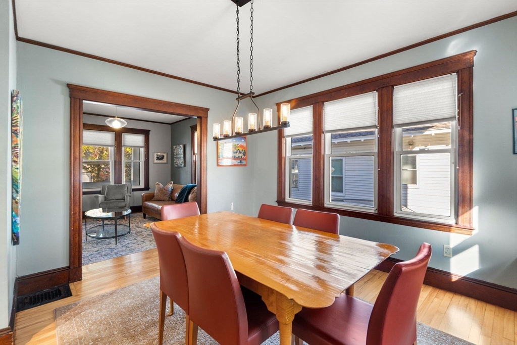 11 Pickman Road Salem, MA 01970 - Photo 10 of 40 a dining room with furniture a chandelier and wooden floor