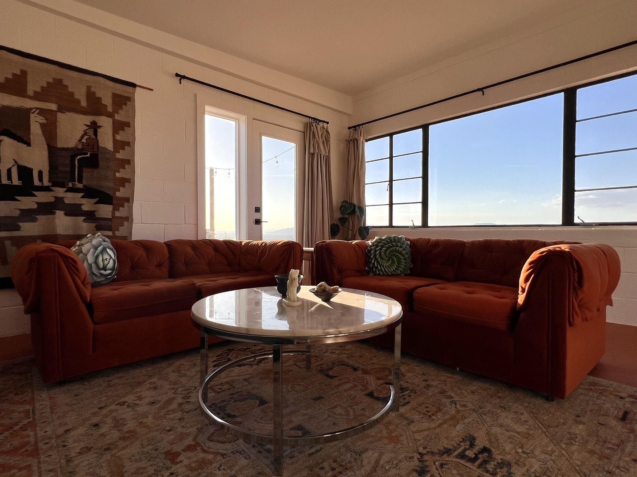 52079 Ocotillo Road Johnson Valley, CA 92285 - Photo 19 of 51 a living room with furniture a flat screen tv and a large window