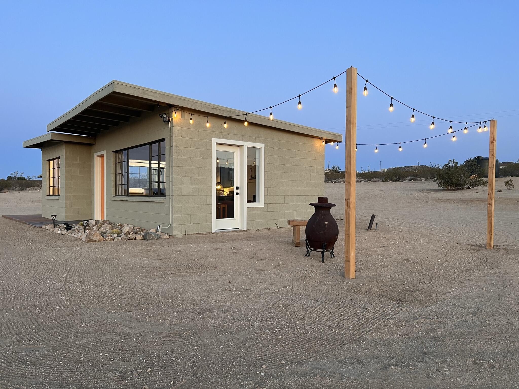 52079 Ocotillo Road Johnson Valley, CA 92285 - Photo 2 of 51 a man sitting on a bench in front of a building