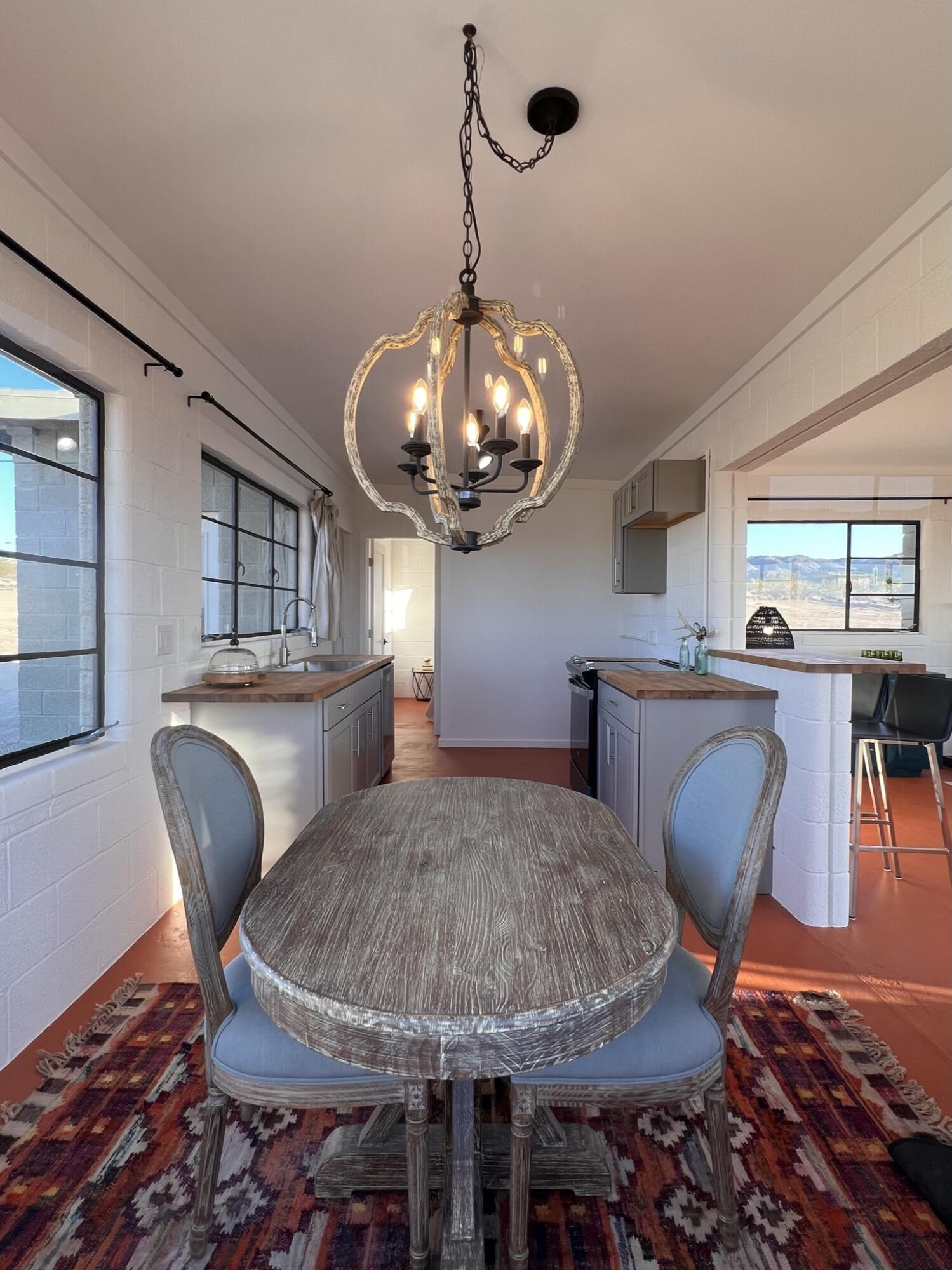 52079 Ocotillo Road Johnson Valley, CA 92285 - Photo 34 of 51 a view of a dining room with furniture and wooden floor
