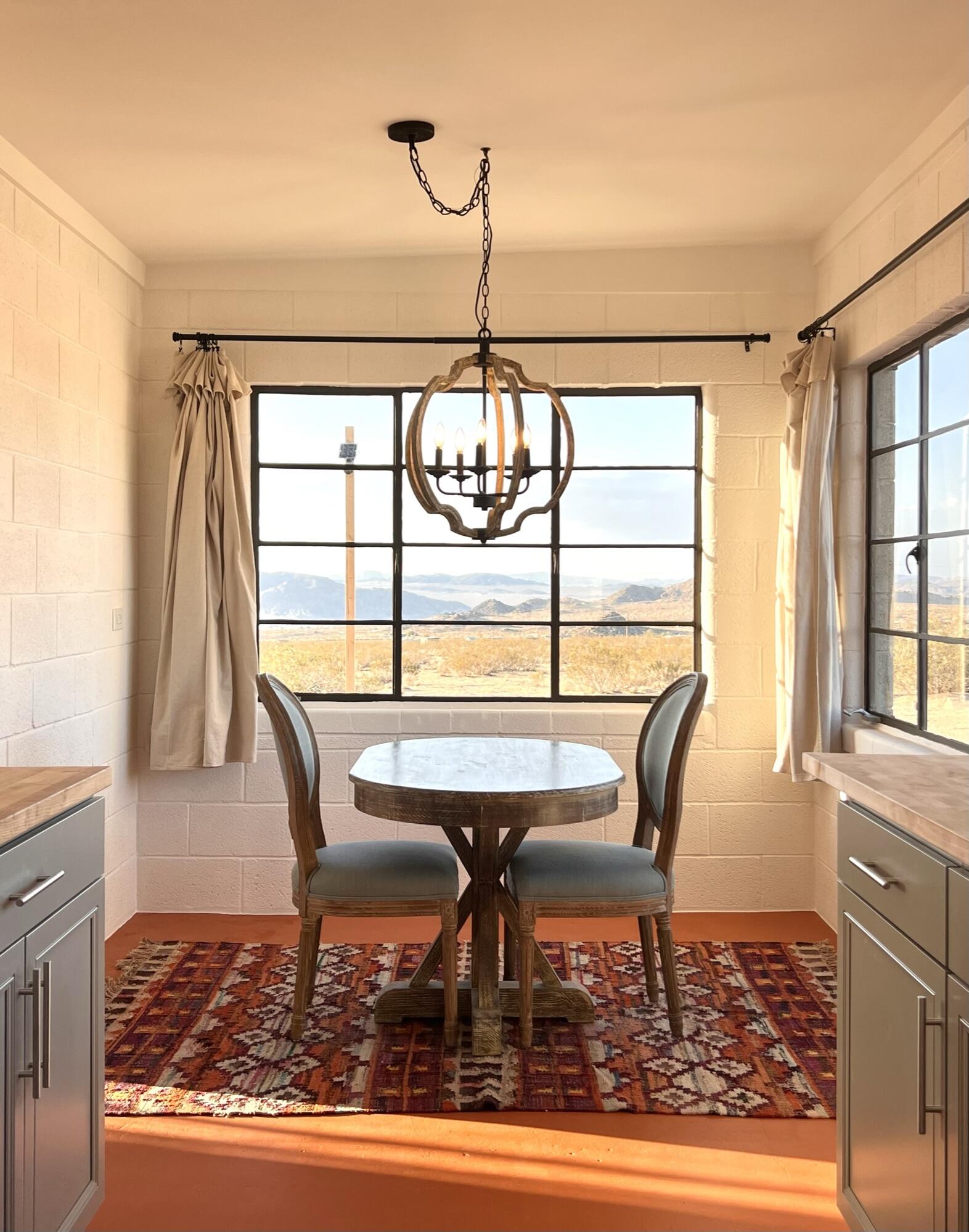52079 Ocotillo Road Johnson Valley, CA 92285 - Photo 36 of 51 a view of a dining room with furniture wooden floor and a rug