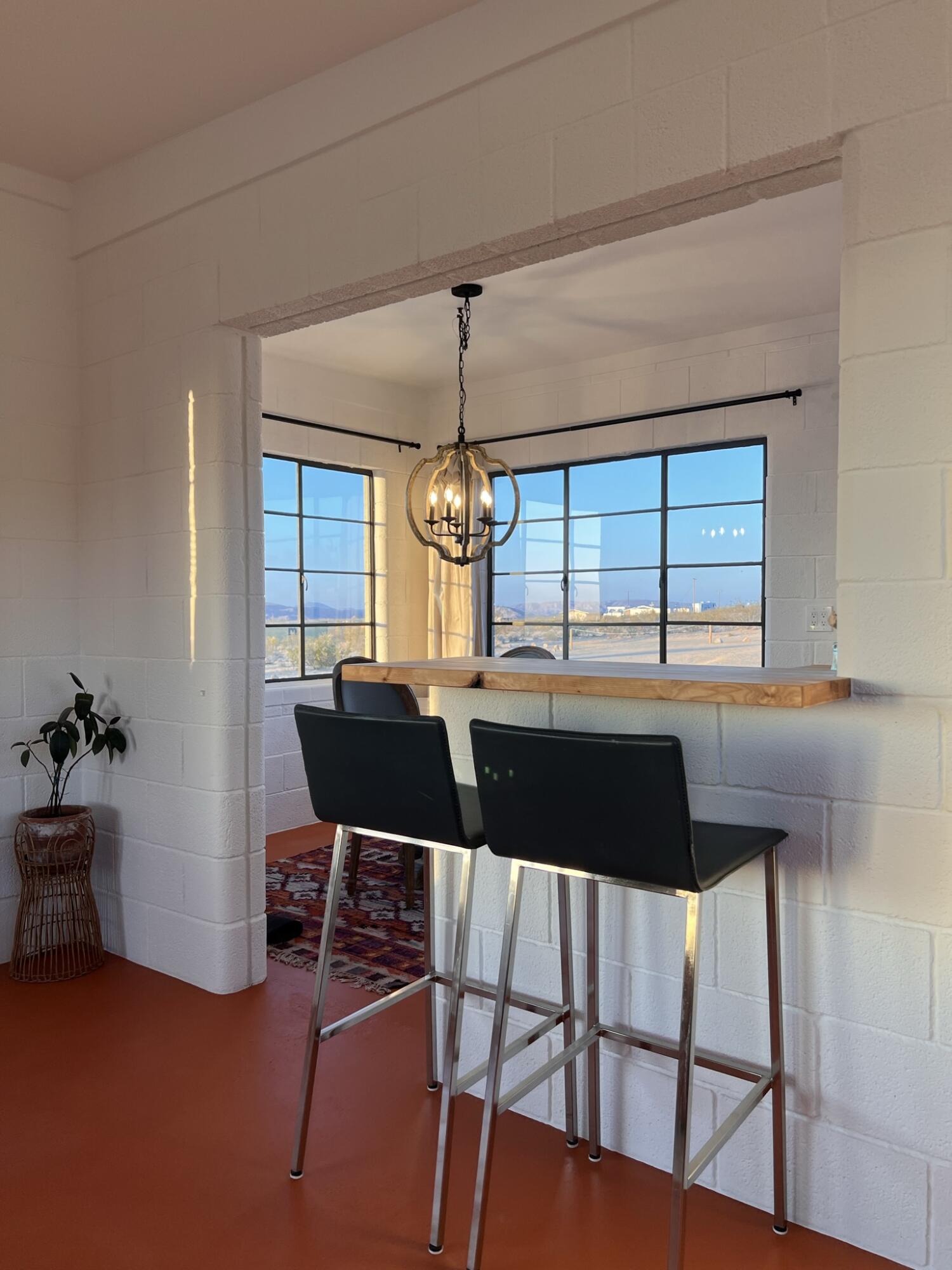 52079 Ocotillo Road Johnson Valley, CA 92285 - Photo 37 of 51 a view of a dining room with furniture window and outside view