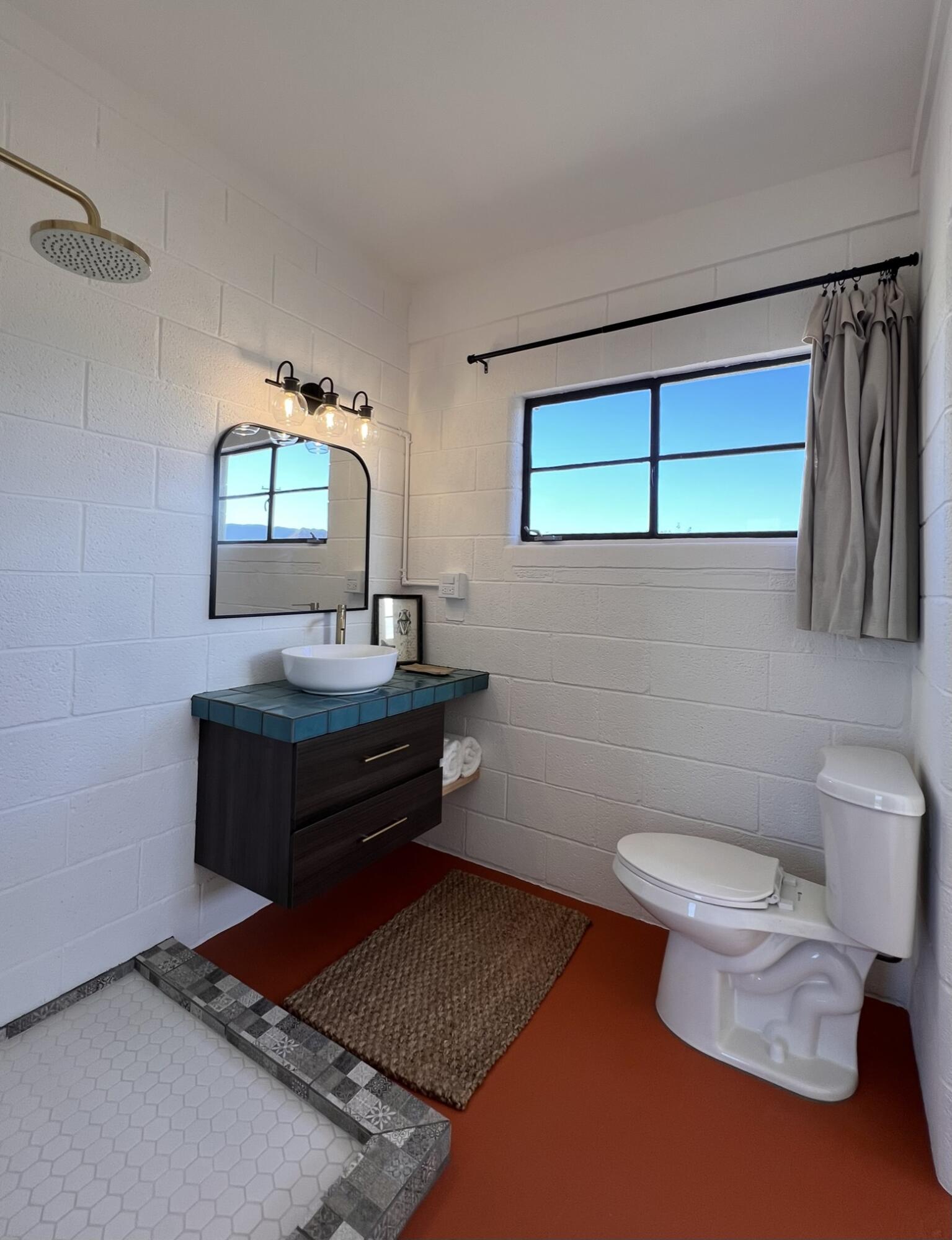 52079 Ocotillo Road Johnson Valley, CA 92285 - Photo 43 of 51 a bathroom with a toilet a sink and mirror
