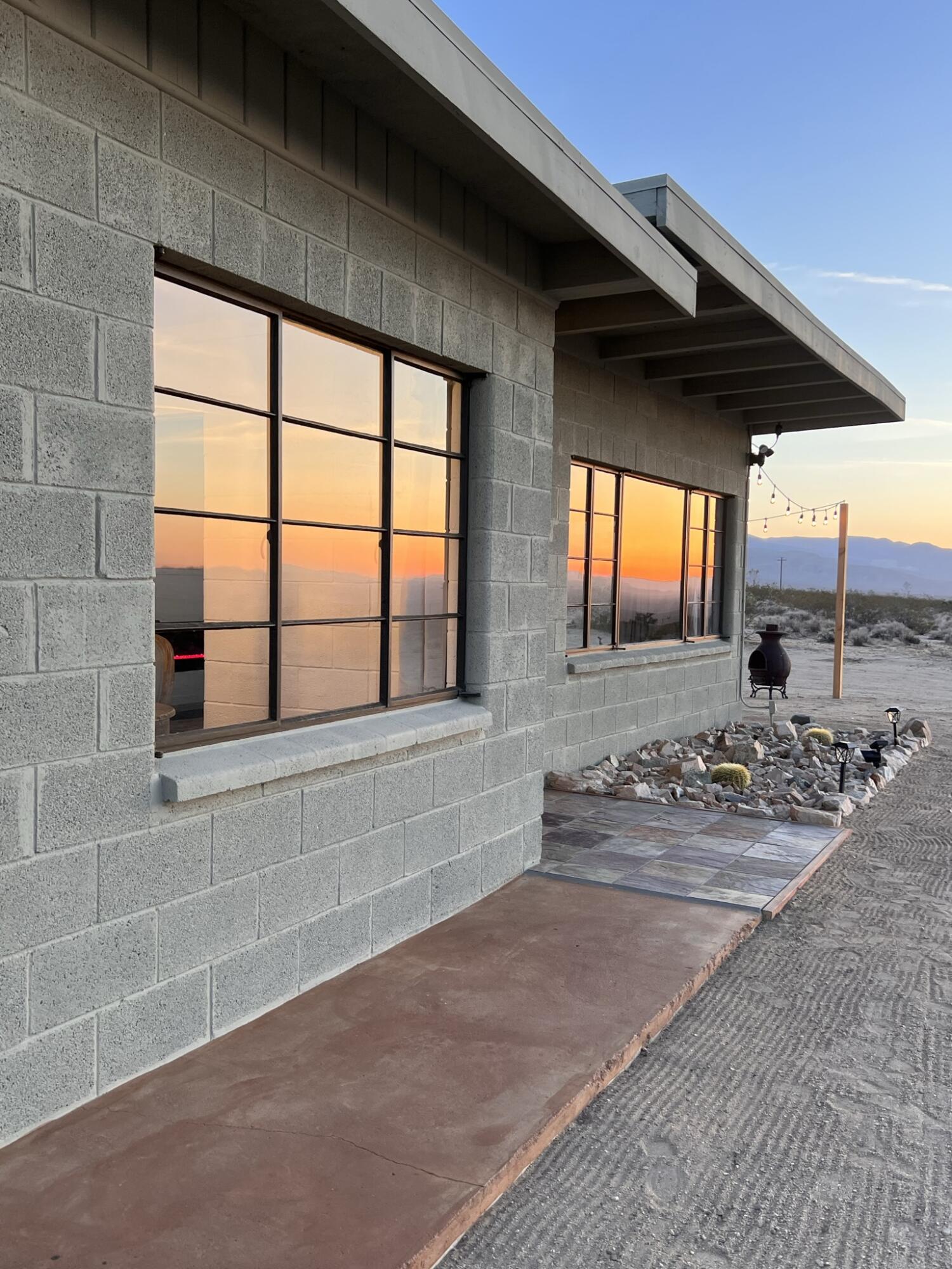 52079 Ocotillo Road Johnson Valley, CA 92285 - Photo 9 of 51 a bathroom with a double vanity sink and a large mirror