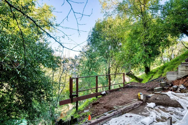 a view of a bench in a backyard