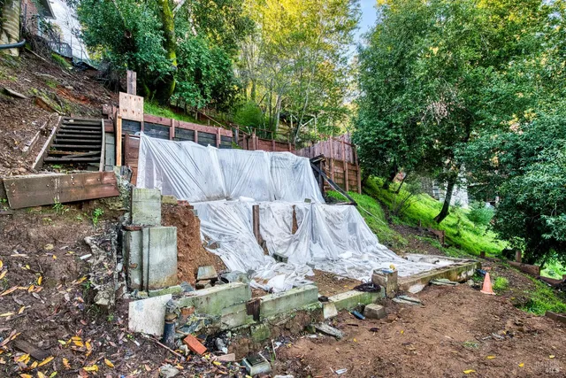 a view of a backyard with sitting area