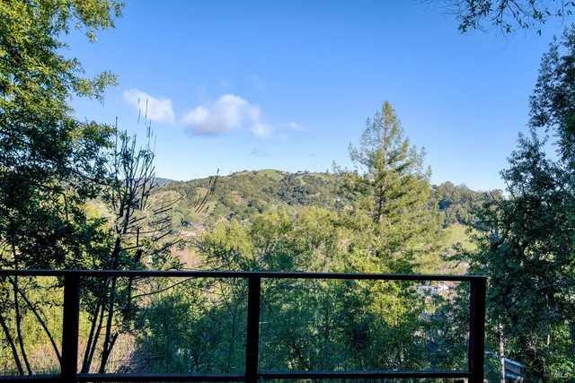 a view of mountain view with lots of trees