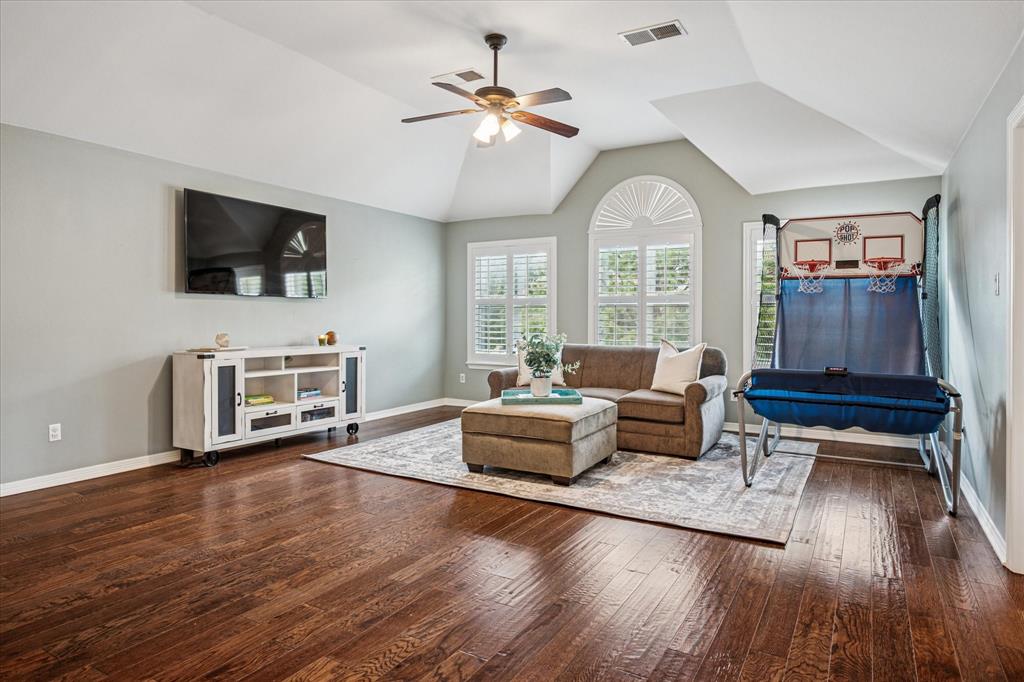 7509 Cedar Elm Drive Irving, TX 75063 - Photo 20 of 40 a living room with furniture and a flat screen tv