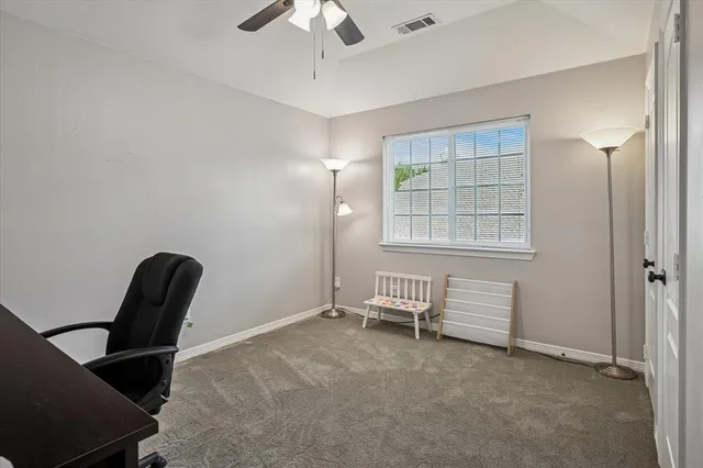 a view of a room with windows and lounge chair