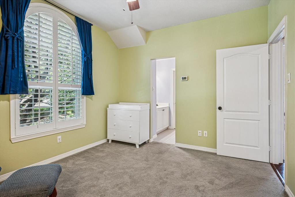 7509 Cedar Elm Drive Irving, TX 75063 - Photo 27 of 40 a view of a room that has a bed and a window