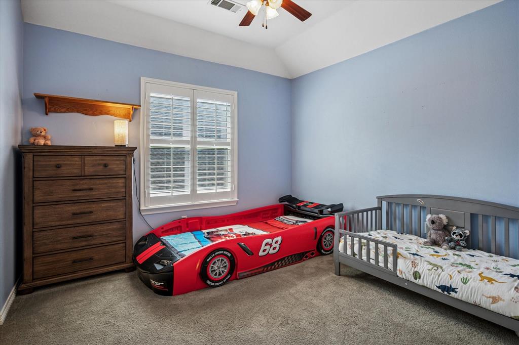 7509 Cedar Elm Drive Irving, TX 75063 - Photo 29 of 40 a bedroom with a bed and a window