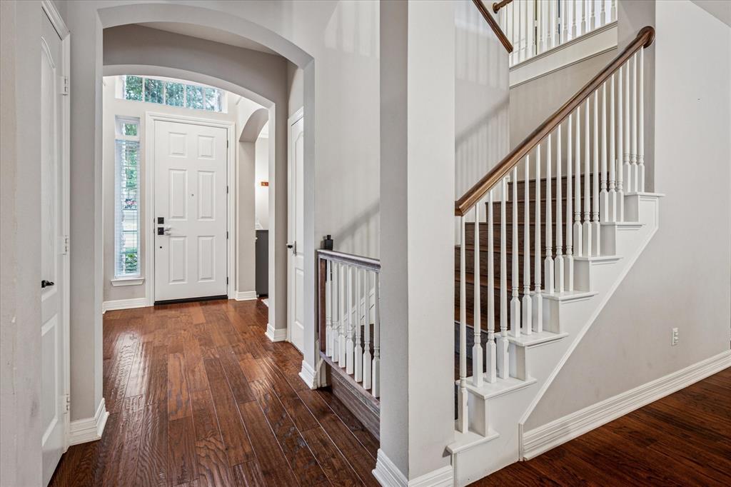 7509 Cedar Elm Drive Irving, TX 75063 - Photo 3 of 40 a view of a hallway with wooden floor and entryway