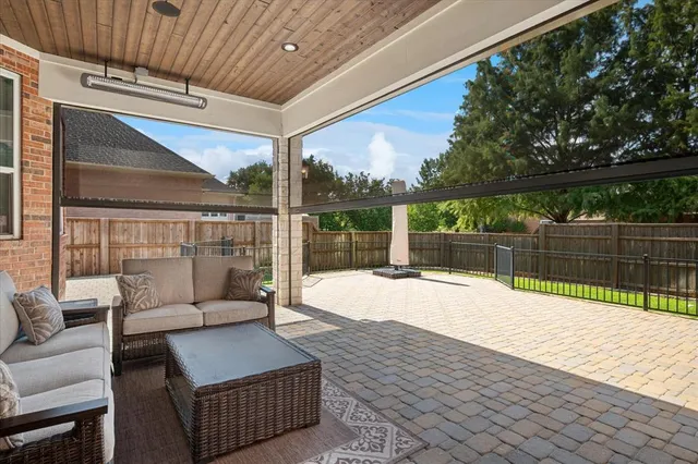 a balcony with furniture and a swing