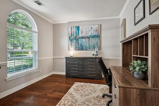 a view of an entryway with wooden floor