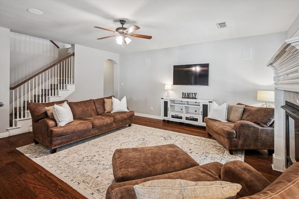 7509 Cedar Elm Drive Irving, TX 75063 - Photo 6 of 40 a living room with furniture and a flat screen tv
