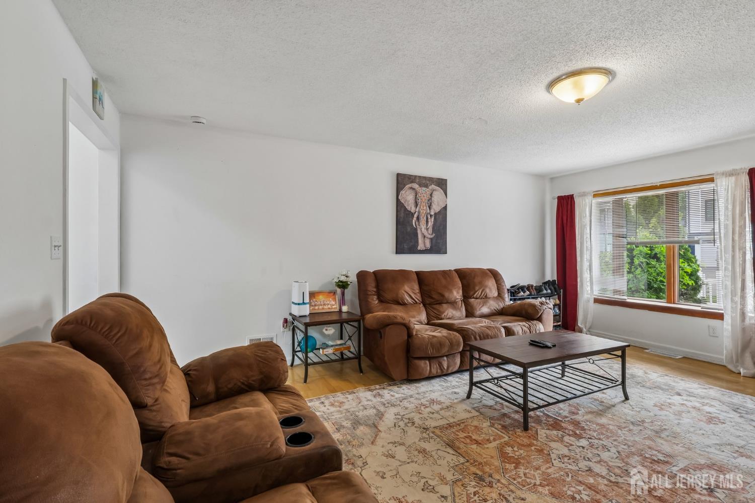36 Henry Street Edison, NJ 08820 - Photo 4 of 42 a living room with furniture and a window