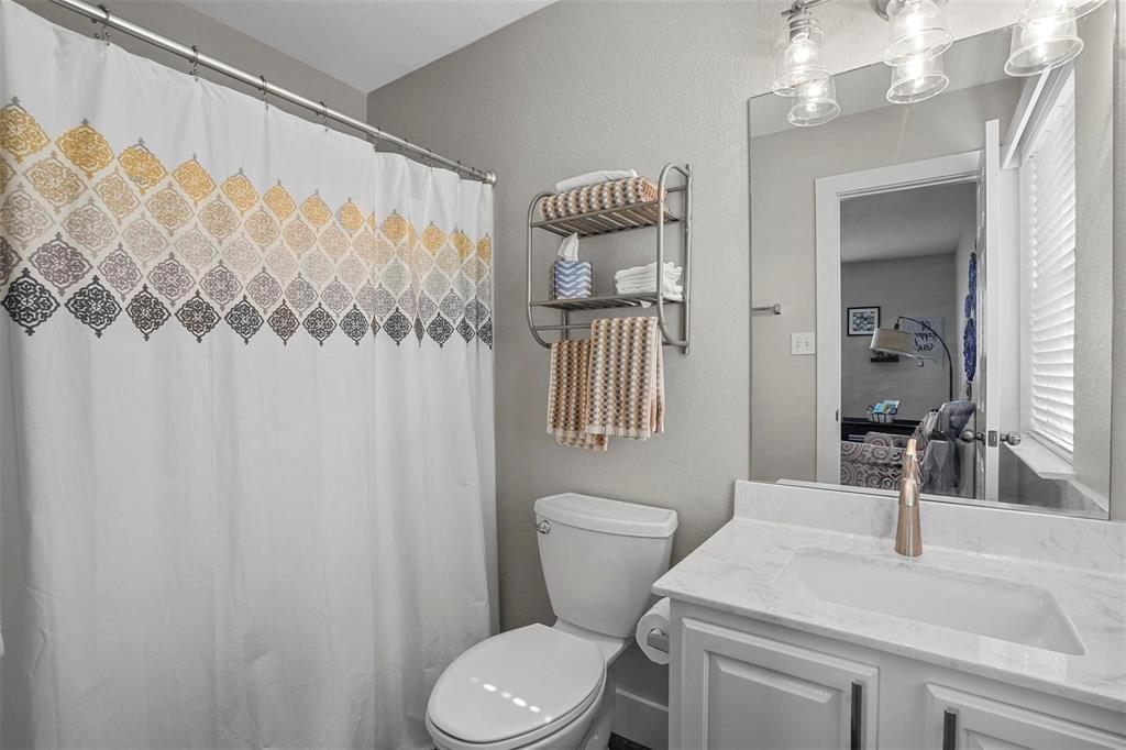 5113 Mountain Spring Trail Fort Worth, TX 76123 - Photo 21 of 35 a bathroom with a granite countertop sink mirror vanity and toilet