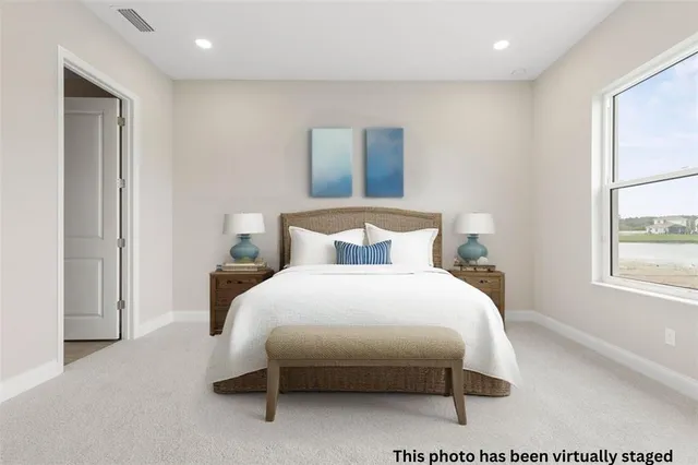 a kitchen with stainless steel appliances granite countertop a sink dishwasher a stove and a refrigerator with wooden floor