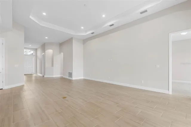 a bathroom with a granite countertop sink a mirror and shower