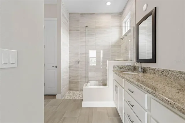 a view of a house with a yard and sitting area